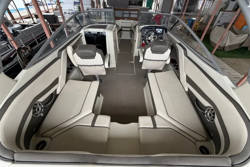 Slide: The Image of 2015 Yamaha Boats 242 Limited S interior with spacious seating and modern dashboard. - 9