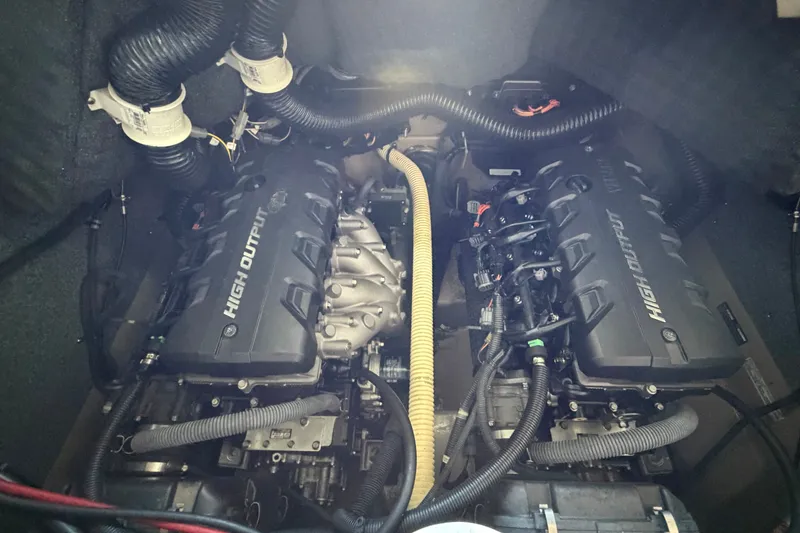 Slide: The Image of Engine compartment of a 2015 Yamaha Boats 242 Limited S, featuring high output engines. - 30