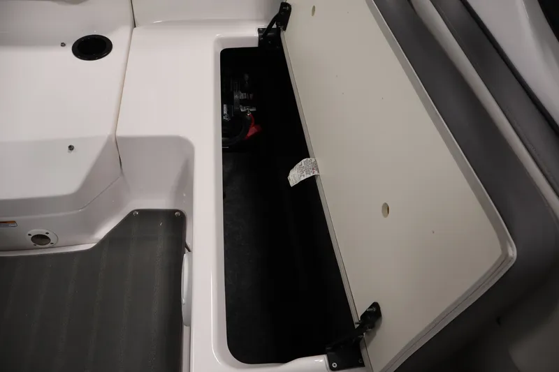Slide: The Image of Open storage compartment on a 2021 Yamaha Boats AR190. - 33