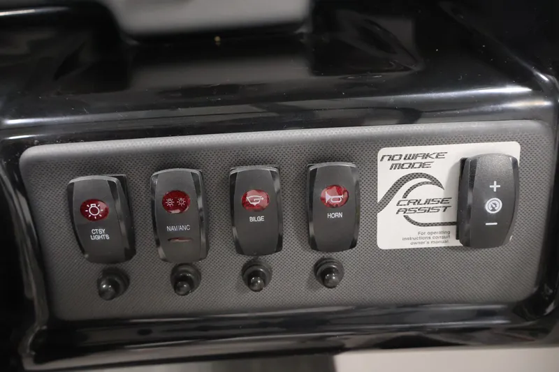Slide: The Image of Control panel of a 2021 Yamaha Boats AR190 featuring various switches and cruise assist. - 24