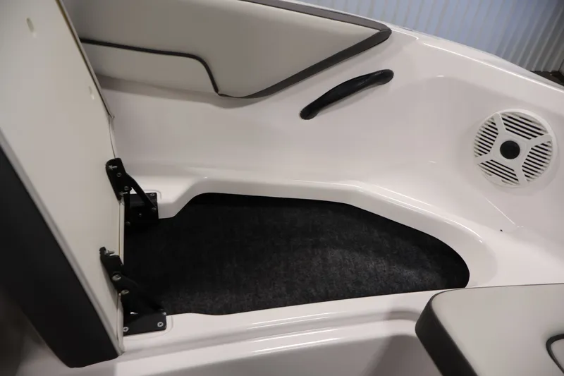 Slide: The Image of Interior view of a 2021 Yamaha AR190 boat, featuring seating and speaker. - 13
