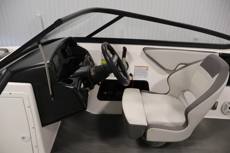 Slide: The Image of 2021 Yamaha Boats AR190 cockpit with steering wheel and captain's seat. - 16