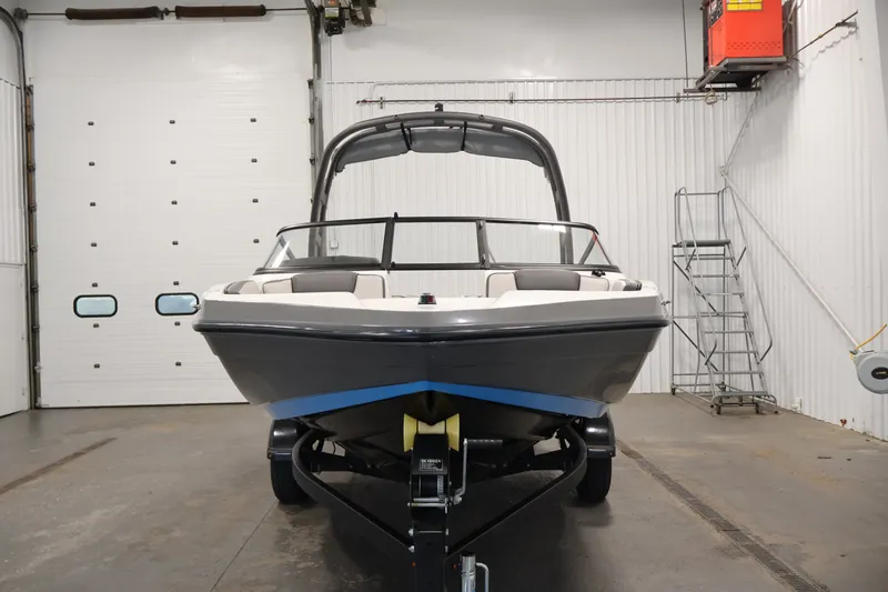 Slide: The Image of 2021 Yamaha Boats AR190 in a garage, front view on trailer. - 2