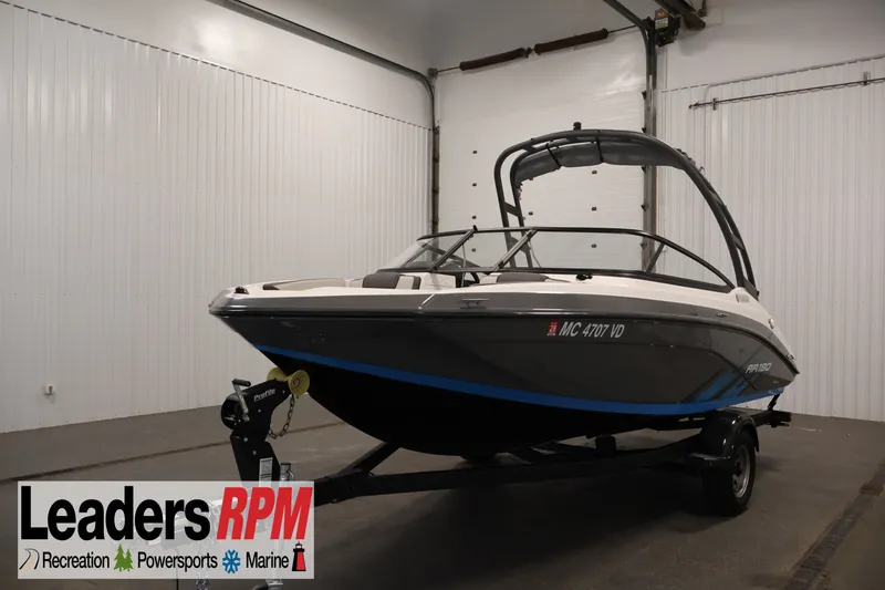 The Image of 2021 Yamaha Boats AR190 on trailer in indoor showroom. - 1