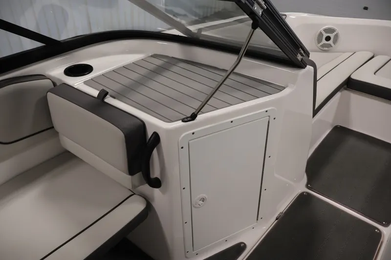 Slide: The Image of 2021 Yamaha Boats AR190 interior seating and storage area with sleek design. - 28