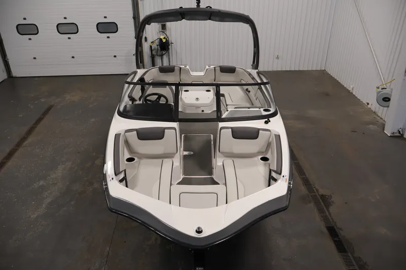 Slide: The Image of 2021 Yamaha Boats AR190 in a garage, showcasing sleek design and spacious seating. - 8
