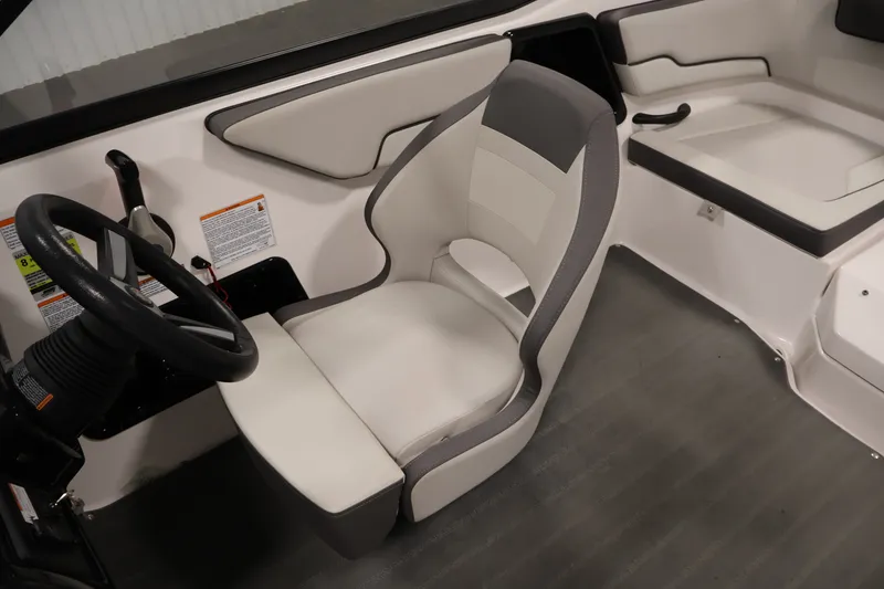 Slide: The Image of 2021 Yamaha Boats AR190 interior with steering wheel and seating area. - 26