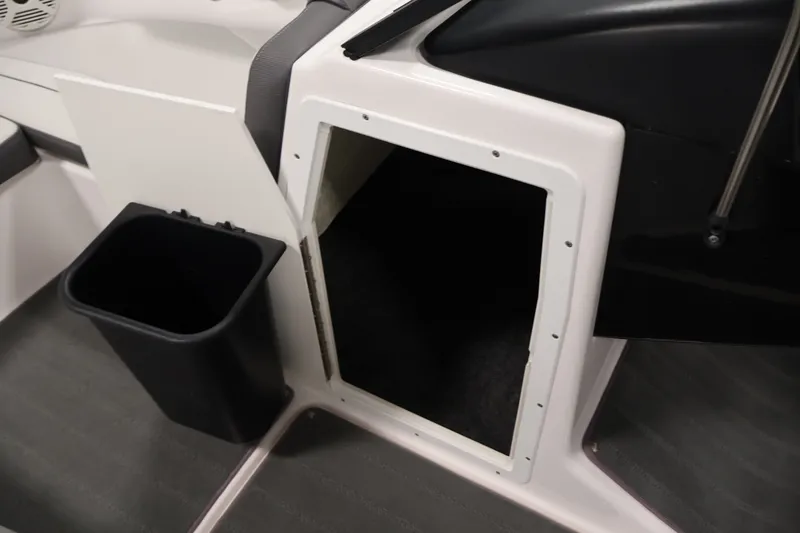 Slide: The Image of 2021 Yamaha AR190 boat interior storage compartment with trash bin. - 18