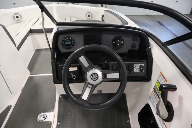 Slide: The Image of 2021 Yamaha Boats AR190 dashboard with steering wheel and control panel. - 19
