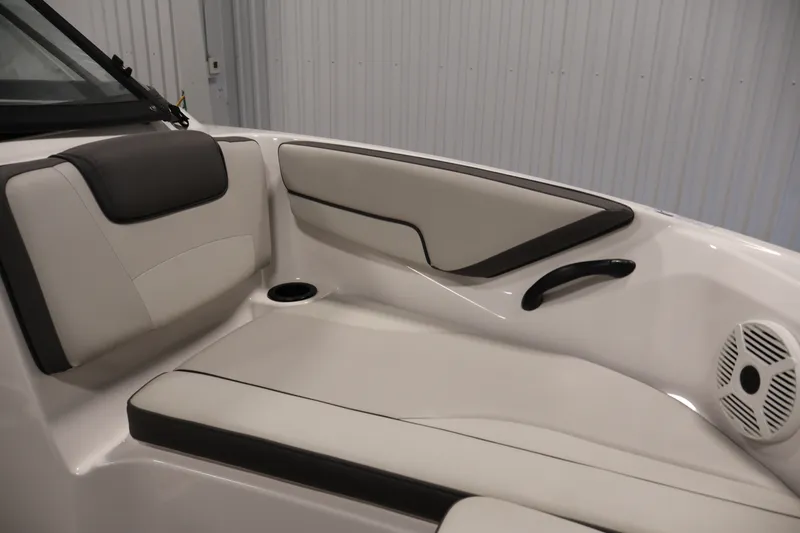 Slide: The Image of 2021 Yamaha AR190 boat interior with cushioned seating and speaker. - 12