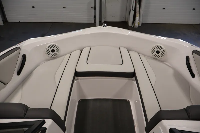 Slide: The Image of 2021 Yamaha Boats AR190 interior with cushioned seating and built-in speakers. - 10