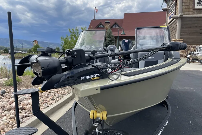 Slide: The Image of 2027 Tracker Targa V-19 Combo boat with Minn Kota Terrova motor, parked outdoors. - 42