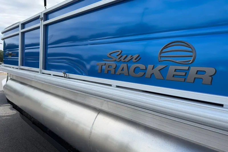 Slide: The Image of 2027 Sun Tracker Party Barge 22 RF DLX pontoon boat with blue exterior. - 12