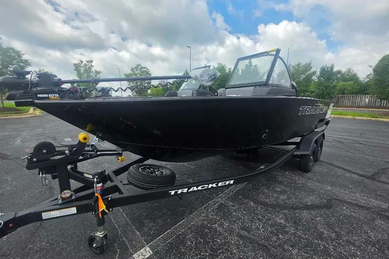 The Image of 2027 Tracker Targa V-19 Combo boat on trailer in parking lot. - 0