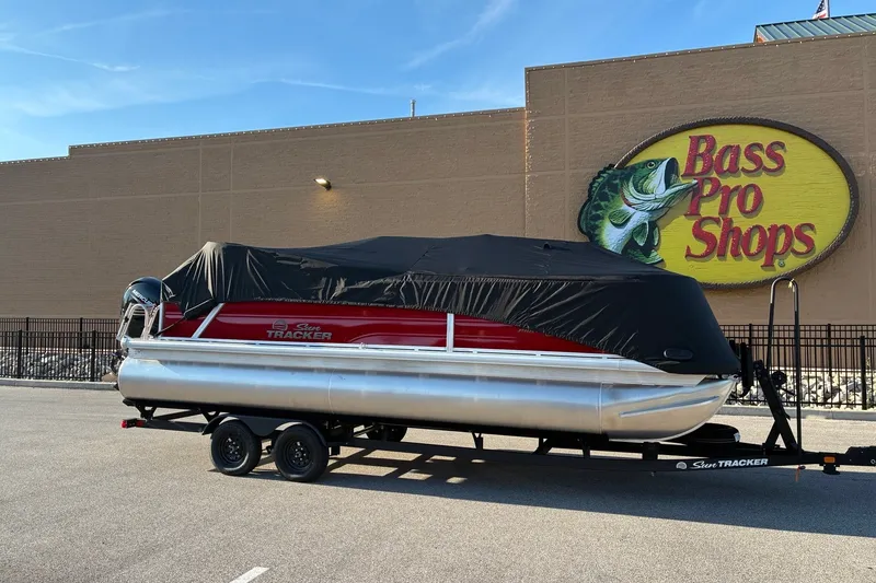 Slide: The Image of 2027 Sun Tracker Party Barge 22 RF DLX covered, parked at Bass Pro Shops. - 19