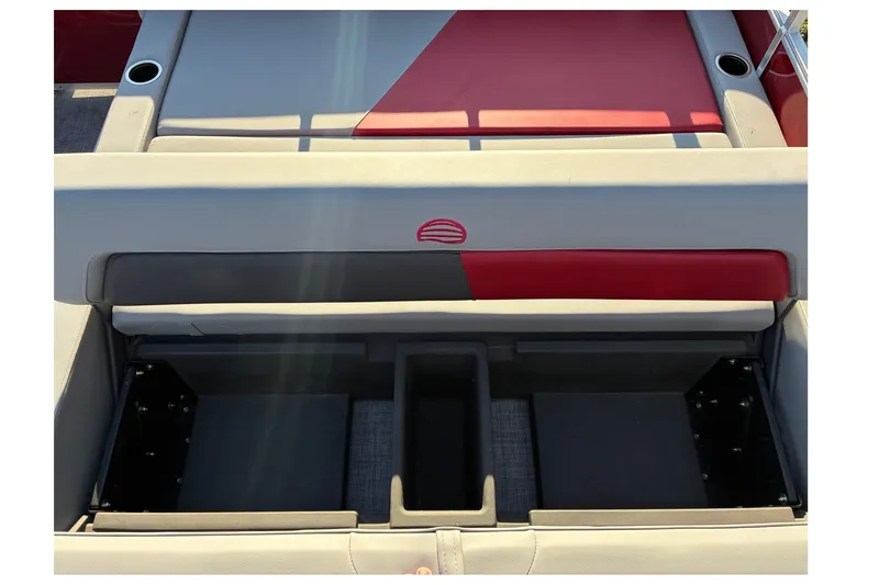 Slide: The Image of 2027 Sun Tracker Party Barge 22 RF DLX storage compartment with red and gray seating. - 14