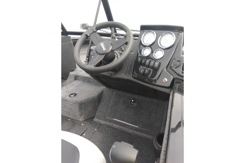 Slide: The Image of 2027 Tracker Targa V-19 Combo boat dashboard with steering wheel and instrument panel. - 42