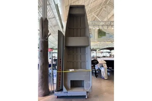 The Image of 2027 Tracker Grizzly 14 Jon boat displayed vertically in a showroom. - 0