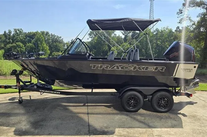 The Image of 2027 Tracker Targa V-19 Combo boat on trailer, parked outdoors. - 0