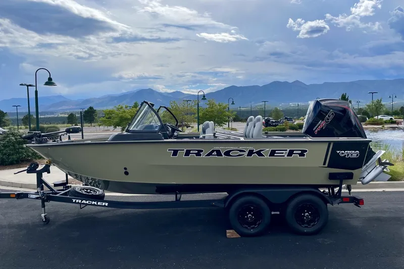 The Image of 2027 Tracker Targa V-19 Combo boat on trailer, scenic mountain backdrop. - 0
