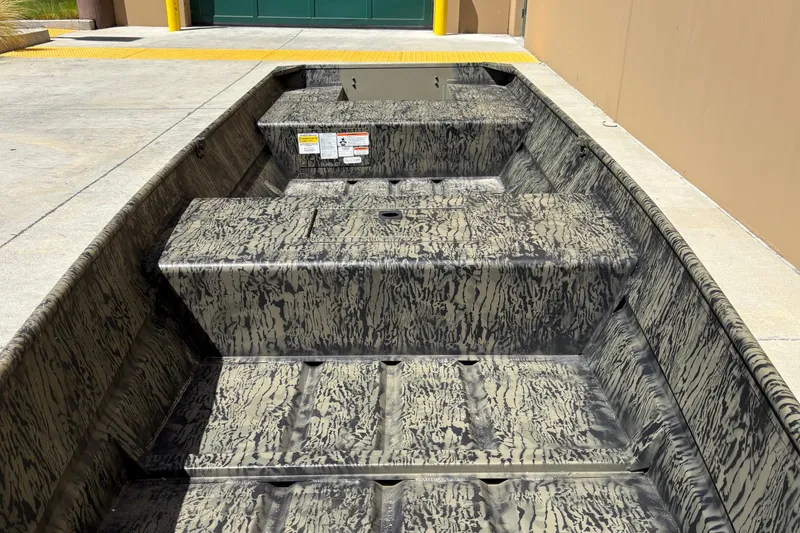 Slide: The Image of 2027 Tracker Grizzly 15 Jon boat with camouflage interior design. - 15