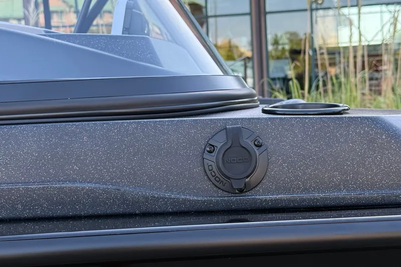 Slide: The Image of 2027 Tracker Targa V-19 Combo boat detail with NOCO charging port. - 13