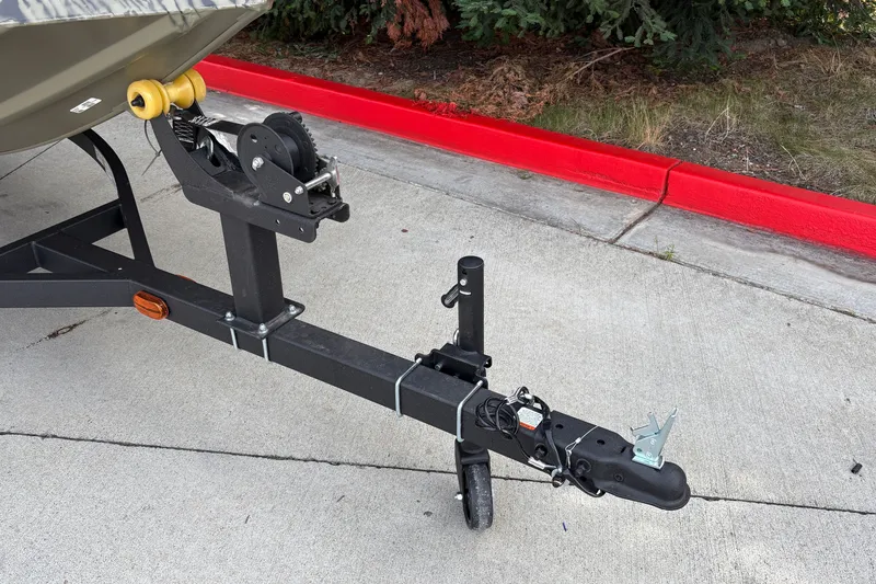 Slide: The Image of Trailer hitch of 2027 Tracker Grizzly 1754 Utility boat on concrete surface. - 17