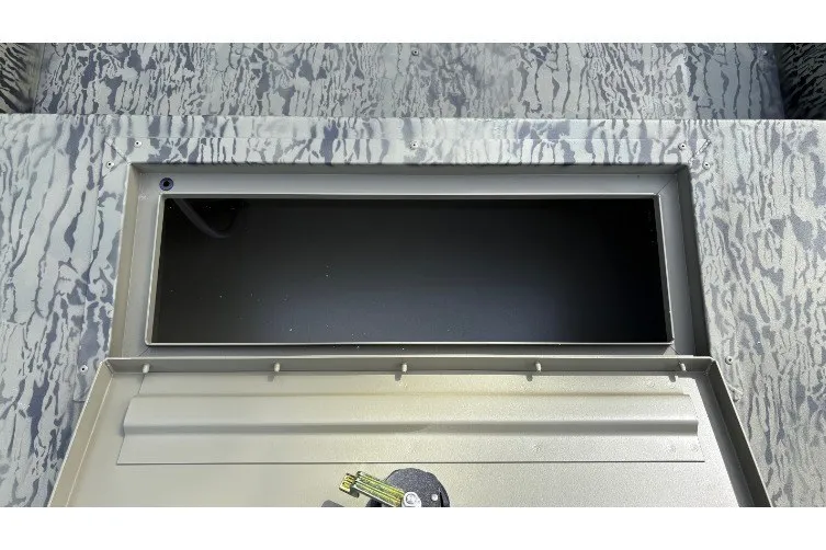 Slide: The Image of 2027 Tracker Grizzly 1754 Utility boat storage compartment with camouflage pattern. - 15