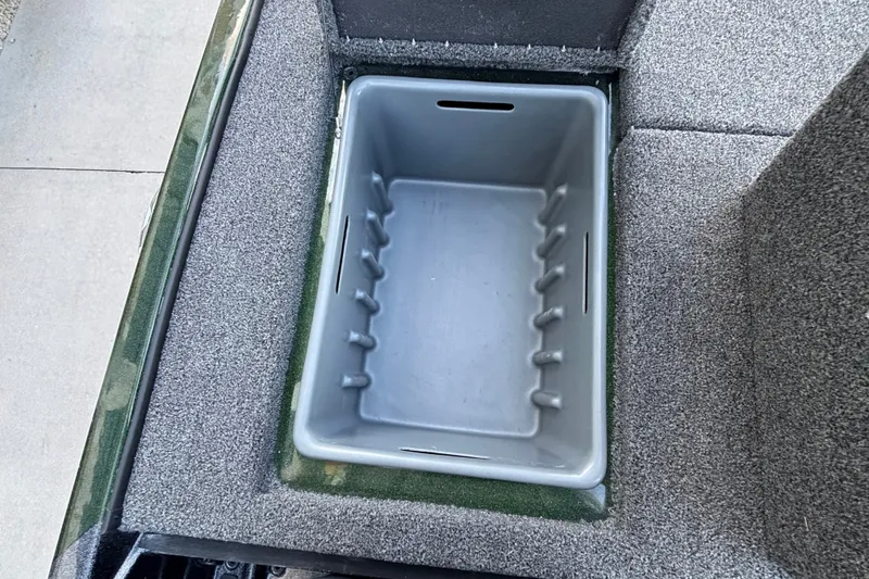 Slide: The Image of Storage compartment in 2027 Nitro Z18 XL Pro boat, featuring a gray interior. - 10