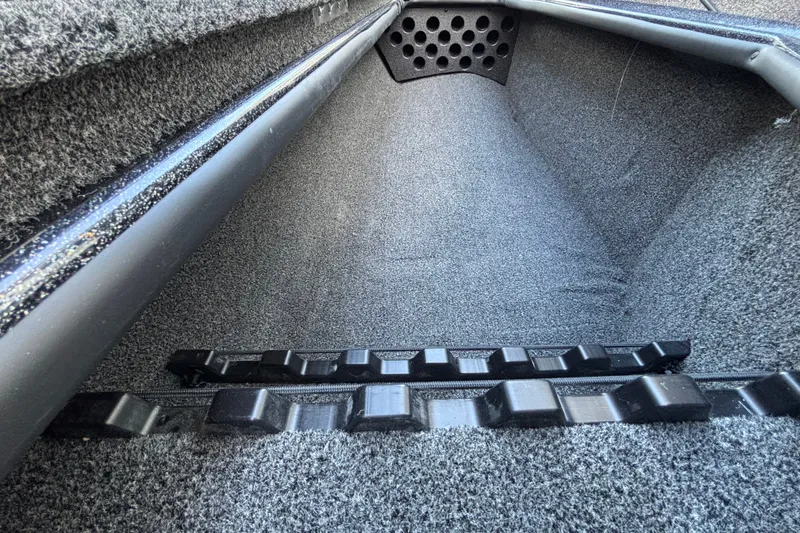 Slide: The Image of Interior view of 2027 Nitro Z18 XL Pro boat compartment with carpeted finish. - 14