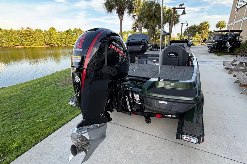 Slide: The Image of 2027 Nitro Z18 XL Pro boat with Mercury 150 Pro XS engine by a lakeside. - 2