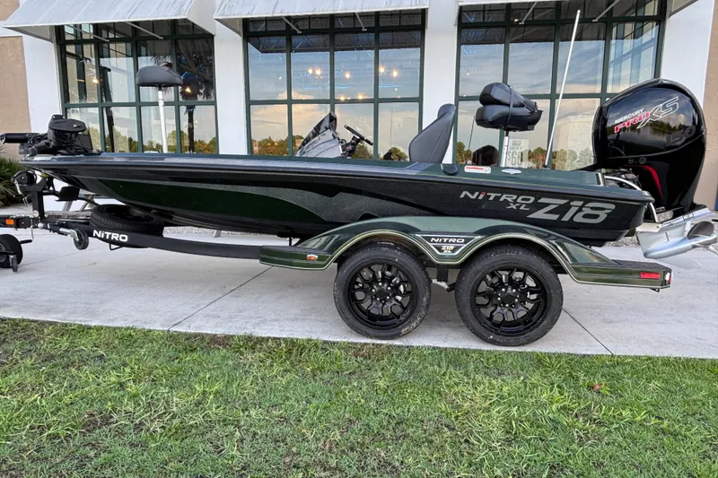 Slide: The Image of 2027 Nitro Z18 XL Pro boat on trailer, parked outdoors near a building. - 4