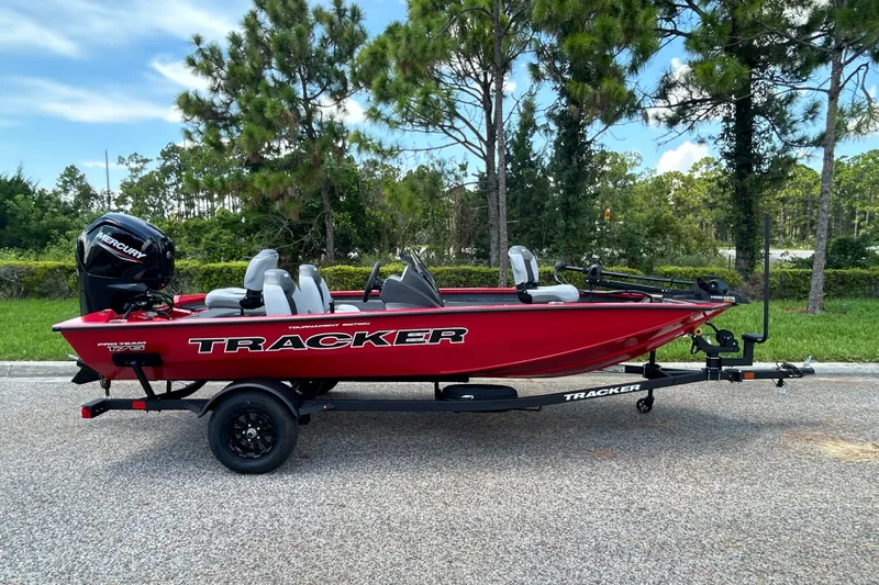The Image of 2027 Tracker Pro Team 175 boat on trailer, parked outdoors. - 0