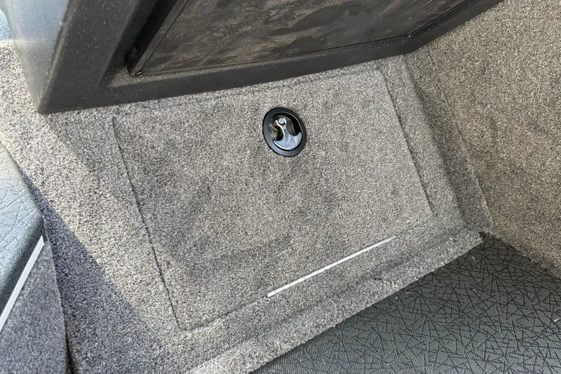 Slide: The Image of Carpeted storage compartment in 2027 Tracker Targa V-19 Combo boat interior. - 30