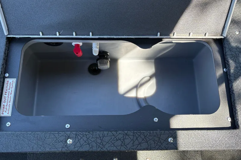 Slide: The Image of Livewell compartment in 2027 Tracker Targa V-19 Combo boat, featuring pump-out feature. - 20