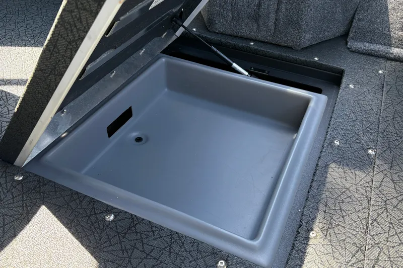 Slide: The Image of Open storage compartment in 2027 Tracker Targa V-19 Combo boat. - 14