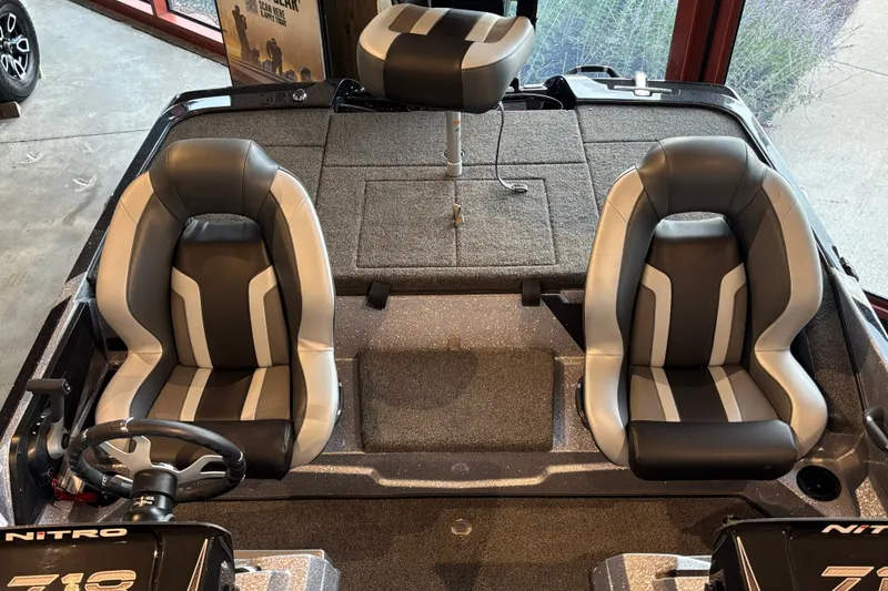Slide: The Image of 2027 Nitro Z18 XL Pro boat interior with dual seats and steering wheel. - 4