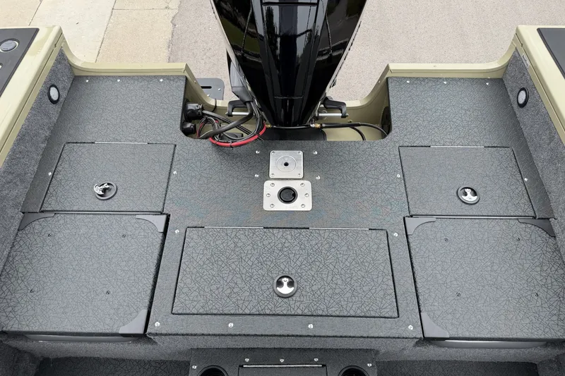 Slide: The Image of 2027 Tracker Targa V-19 Combo boat deck with storage compartments and motor mount. - 20