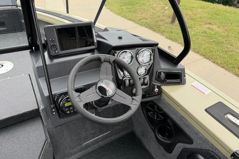 Slide: The Image of 2027 Tracker Targa V-19 Combo boat dashboard with steering wheel and navigation system. - 16