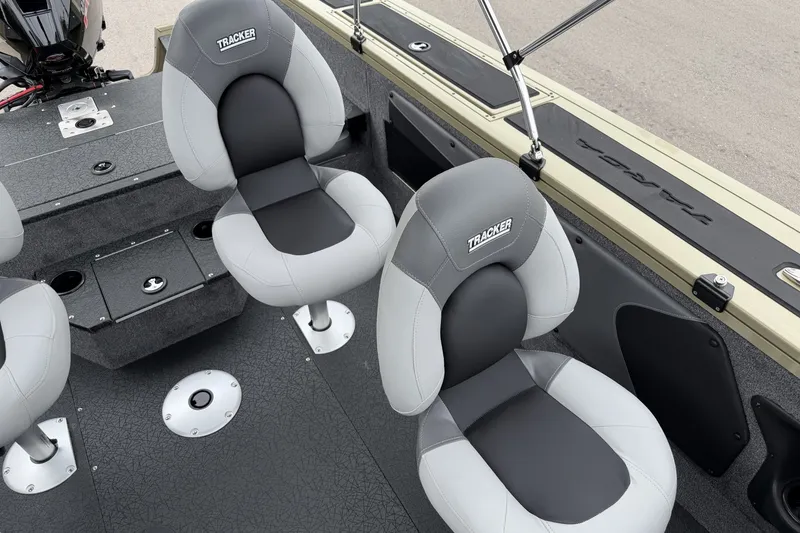 Slide: The Image of 2027 Tracker Targa V-19 Combo boat interior with gray cushioned seats. - 17