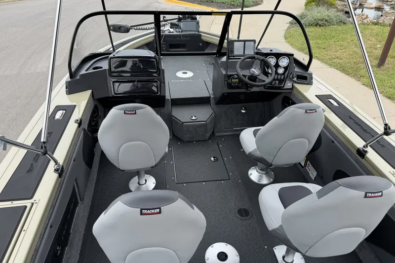 Slide: The Image of Interior of a 2027 Tracker Targa V-19 Combo boat with four seats and steering console. - 13