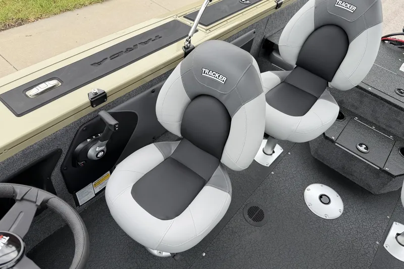 Slide: The Image of 2027 Tracker Targa V-19 Combo boat interior with dual gray and black seats. - 15