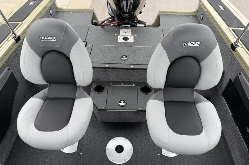 Slide: The Image of 2027 Tracker Targa V-19 Combo boat interior with two cushioned seats and storage compartments. - 19