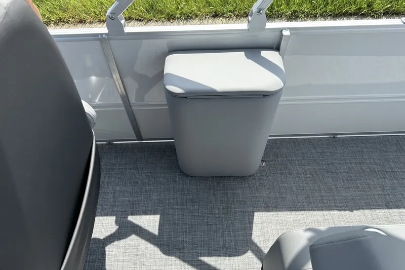 Slide: The Image of 2027 Sun Tracker Party Barge 22 RF DLX interior with gray seating and flooring. - 18