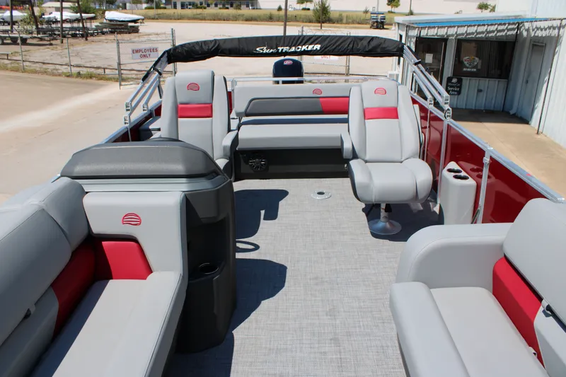 Slide: The Image of 2027 Sun Tracker Party Barge 22 RF DLX interior with gray and red seating. - 15