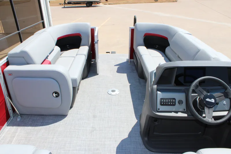 Slide: The Image of 2027 Sun Tracker Party Barge 22 RF DLX interior with spacious seating and modern helm. - 16