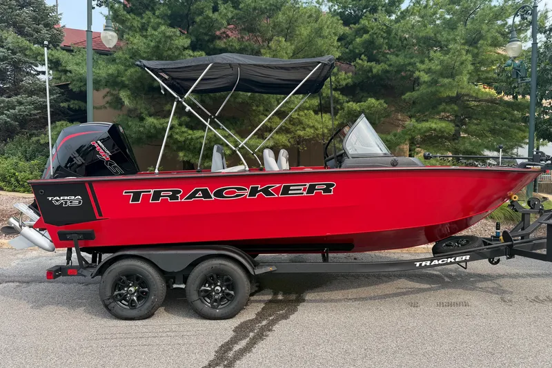 The Image of 2027 Tracker Targa V-19 Combo boat in vibrant red on a trailer. - 0