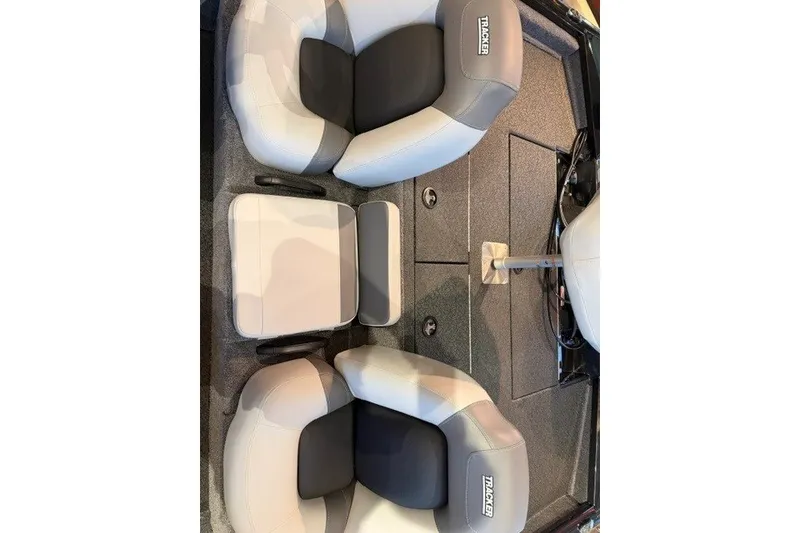 Slide: The Image of 2027 Tracker Pro Team 195 boat interior with cushioned seating and storage compartments. - 13