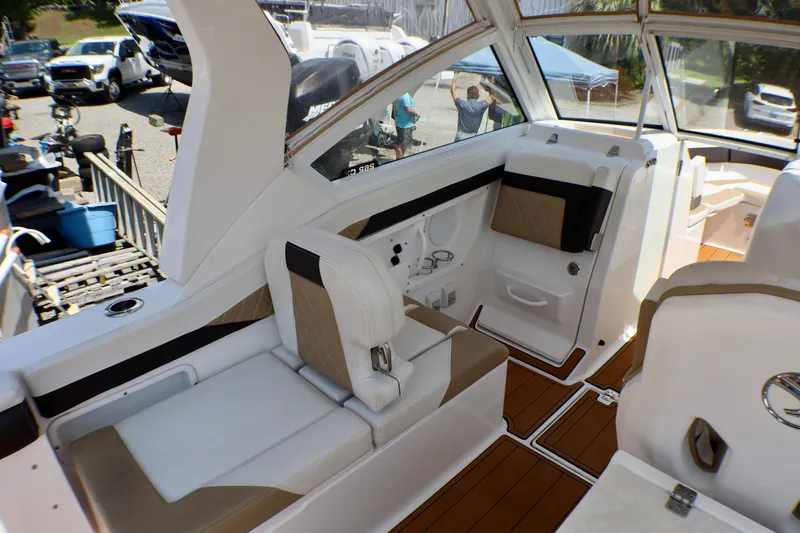 Slide: The Image of 2023 Edgewater 262CX Crossover boat interior with luxurious seating and modern design. - 20