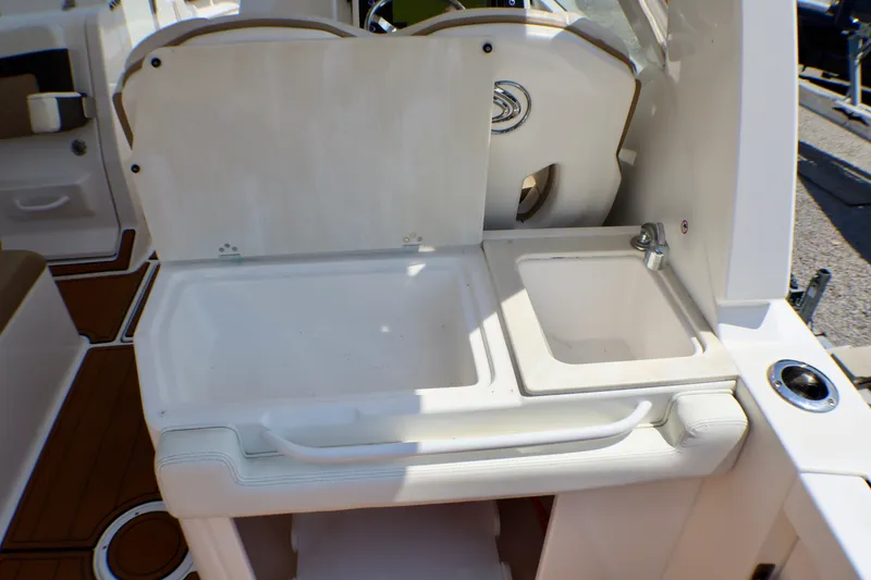 Slide: The Image of 2023 Edgewater 262CX Crossover boat sink and counter area with faucet. - 27